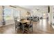 An open-concept living area showcases a dining area, a spacious living room, and natural light at 3735 Westhaven Dr, Cumming, GA 30040