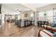 Bright and open floor plan with an oversized sofa set, large windows, and access to other living areas at 3735 Westhaven Dr, Cumming, GA 30040