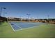 Tennis courts located in the community on a sunny day. Featuring green and blue courts with black fencing at 3735 Westhaven Dr, Cumming, GA 30040