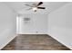 Spacious bedroom boasting sleek wood floors and a modern ceiling fan at 4520 Coopers Creek Se Cir, Smyrna, GA 30082