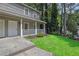 Inviting townhome with a covered front porch and well-maintained lawn, creating a welcoming entrance at 4520 Coopers Creek Se Cir, Smyrna, GA 30082