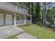 The beautiful front lawn with a walkway leads to the inviting covered porch at 4520 Coopers Creek Se Cir, Smyrna, GA 30082
