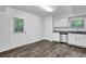 A kitchenette has stainless steel appliances, white cabinets, and granite countertops at 4520 Coopers Creek Se Cir, Smyrna, GA 30082