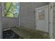 Cozy patio with gray siding and a white door at 4520 Coopers Creek Se Cir, Smyrna, GA 30082