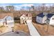 Aerial view of a property showing its landscaped yard and proximity to other homes at 4865 Fourth Rail Ln, Cumming, GA 30040