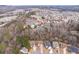 Aerial view showcasing homes near community amenities, including pool, playground, and tennis courts at 4865 Fourth Rail Ln, Cumming, GA 30040