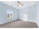 Bright bedroom with carpet and large window showing backyard at 4865 Fourth Rail Ln, Cumming, GA 30040