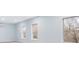 Bright bedroom features neutral carpeting, fresh paint, ample windows, and great natural light at 4865 Fourth Rail Ln, Cumming, GA 30040