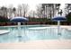 Inviting community pool featuring mushroom fountains and ample space for relaxation and recreation at 4865 Fourth Rail Ln, Cumming, GA 30040