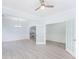 A large dining room with gray vinyl plank flooring, double doors and wainscotting is displayed at 4865 Fourth Rail Ln, Cumming, GA 30040