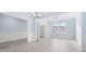 A dining room is bathed in light with gray vinyl plank flooring and double doors leading to the entryway at 4865 Fourth Rail Ln, Cumming, GA 30040