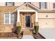 A two-story brick house features a covered front porch, and two-car garage at 4865 Fourth Rail Ln, Cumming, GA 30040