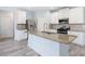 Kitchen with stainless steel appliances, granite counters, a large island, and gray floors at 4865 Fourth Rail Ln, Cumming, GA 30040