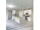 Spacious kitchen with stainless steel appliances, gray backsplash, and granite countertops at 4865 Fourth Rail Ln, Cumming, GA 30040