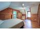 Charming bedroom features hardwood floors, wood paneled walls, ceiling fan and bright natural light at 1066 Sea Oats Sw Way, Lilburn, GA 30047