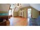 Versatile bonus room with wood floors, a desk, and ample space, perfect for a home office or recreation area at 1066 Sea Oats Sw Way, Lilburn, GA 30047