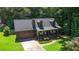 Traditional home featuring an attached garage, inviting front porch and mature landscaping at 1066 Sea Oats Sw Way, Lilburn, GA 30047