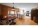 Open kitchen with hardwood floors, stainless steel appliances, and butcher block island seating at 1066 Sea Oats Sw Way, Lilburn, GA 30047