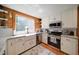 Well-lit kitchen featuring white cabinets, stainless steel appliances, and granite countertops at 1066 Sea Oats Sw Way, Lilburn, GA 30047
