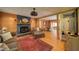 Inviting living room with a stone fireplace, wood floors, and natural light at 1066 Sea Oats Sw Way, Lilburn, GA 30047