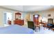 Bedroom featuring a bed, a dresser, and a sitting area at 1810 Stardust Trl, Cumming, GA 30040