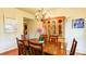 Cozy dining room featuring hardwood floors, vintage chandelier and wall art at 1810 Stardust Trl, Cumming, GA 30040