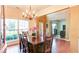 Bright dining area featuring wood floors, a stylish chandelier and lots of natural light at 1810 Stardust Trl, Cumming, GA 30040