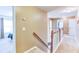 Hallway with carpeted floor and wood railing at 1810 Stardust Trl, Cumming, GA 30040