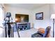 Comfortable home gym and entertainment area with mounted TV and recliner chair at 1810 Stardust Trl, Cumming, GA 30040