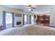 Spacious living room open to the kitchen, with fireplace and natural light at 1810 Stardust Trl, Cumming, GA 30040