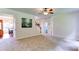 An inviting space with staircase, ceiling fan and carpeted floor at 1810 Stardust Trl, Cumming, GA 30040