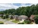 Street view features well-maintained homes with manicured lawns in a tree-lined neighborhood at 1810 Stardust Trl, Cumming, GA 30040