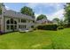 Spacious backyard with a deck, expansive lawn, and mature landscaping at 2055 Beacon Hill Way, Alpharetta, GA 30005