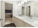 Bathroom with a marble countertop vanity featuring double sinks and plenty of natural light at 2055 Beacon Hill Way, Alpharetta, GA 30005