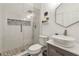 Modern bathroom features a glass shower with stylish tile accents and a vessel sink at 2055 Beacon Hill Way, Alpharetta, GA 30005