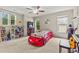 Playful bedroom featuring a car-shaped bed, arcade game, and unique decor at 2055 Beacon Hill Way, Alpharetta, GA 30005