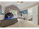 Cozy bedroom featuring vaulted ceiling, unique decor, and bright natural light at 2055 Beacon Hill Way, Alpharetta, GA 30005