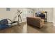 Multipurpose room featuring hardwood floors, seating area and fitness equipment at 2055 Beacon Hill Way, Alpharetta, GA 30005