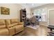 Bonus room with comfortable seating, and home office area at 2055 Beacon Hill Way, Alpharetta, GA 30005