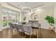 Dining room with decorative chandelier and tray ceiling at 2055 Beacon Hill Way, Alpharetta, GA 30005