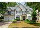 Charming traditional-style home with lush landscaping and a two-car garage at 2055 Beacon Hill Way, Alpharetta, GA 30005