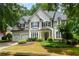Charming traditional-style home with lush landscaping and a two-car garage at 2055 Beacon Hill Way, Alpharetta, GA 30005