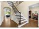 Welcoming foyer with wood floors, stairs, and an adjacent office space at 2055 Beacon Hill Way, Alpharetta, GA 30005