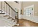 Foyer with hardwood floors and ornate staircase details at 2055 Beacon Hill Way, Alpharetta, GA 30005