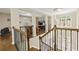 Elegant foyer showcasing staircase, chandelier, and views into adjacent living spaces at 2055 Beacon Hill Way, Alpharetta, GA 30005