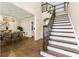 Elegant foyer with hardwood floors, staircase, and views into the dining room at 2055 Beacon Hill Way, Alpharetta, GA 30005
