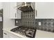 Modern kitchen with stainless steel appliances and gas range at 2055 Beacon Hill Way, Alpharetta, GA 30005
