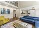 Bright living room with hardwood floors, soaring ceilings and open floor plan to the modern kitchen at 2055 Beacon Hill Way, Alpharetta, GA 30005