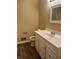 Bathroom featuring a white vanity, framed mirror, and wood-look flooring at 2475 Cajun Dr, Marietta, GA 30066