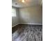 Bedroom with a window and wood look flooring at 2475 Cajun Dr, Marietta, GA 30066